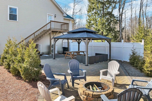12 Wildwood Rd, Gilford, NH 03249 - view of patio / terrace with an outdoor fire pit, a gazebo, stairway, and fence