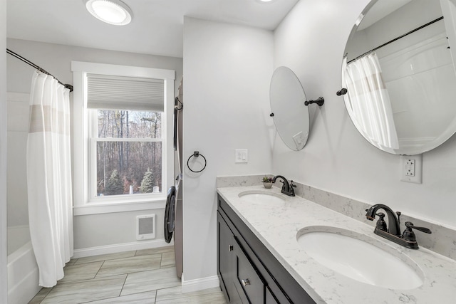 12 Wildwood Rd, Gilford, NH 03249 - full bath with double vanity, visible vents, baseboards, and a sink