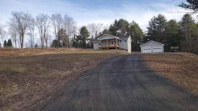 1761 US Route 2, East Montpelier, VT 05651 - view of front of property with a garage, driveway, and an outdoor structure