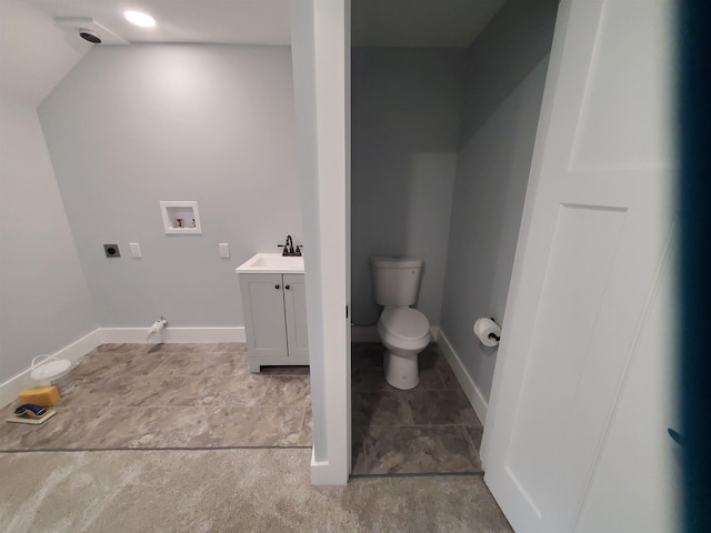 1761 US Route 2, East Montpelier, VT 05651 - bathroom with vanity, baseboards, and toilet
