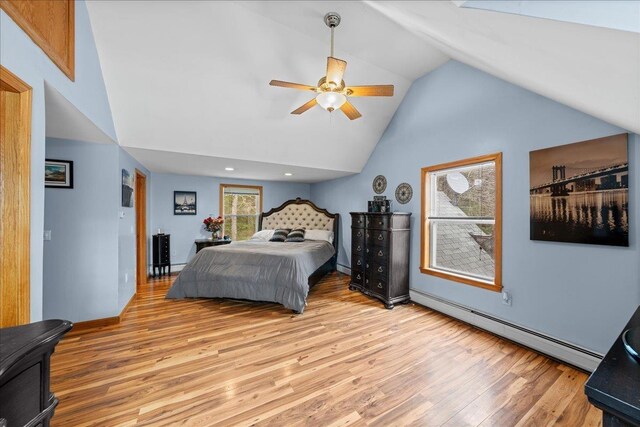 bedroom with ceiling fan, light wood finished floors, high vaulted ceiling, and baseboard heating