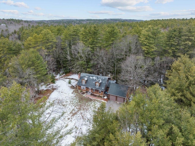 birds eye view of property with a wooded view