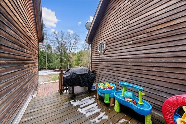 wooden deck with area for grilling