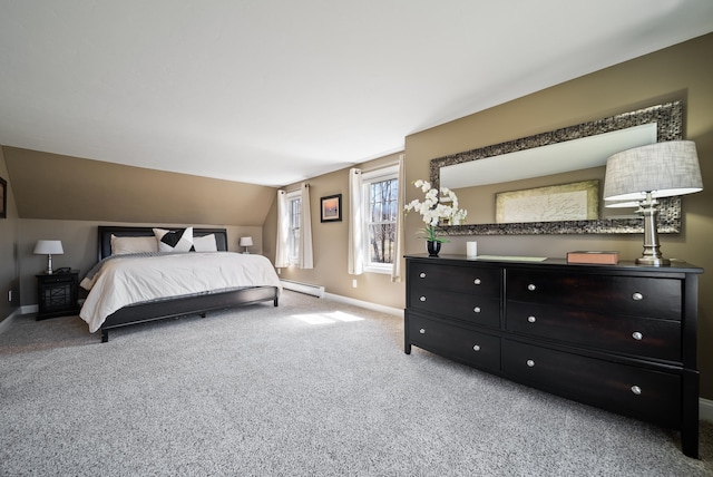 bedroom with a baseboard radiator, baseboards, vaulted ceiling, and carpet floors