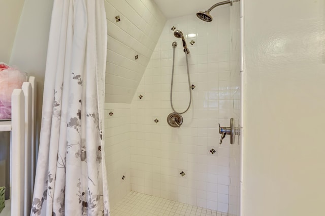 bathroom with a tile shower