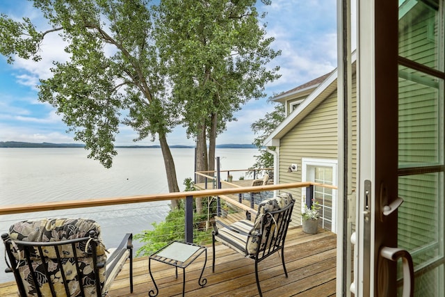 deck featuring a water view