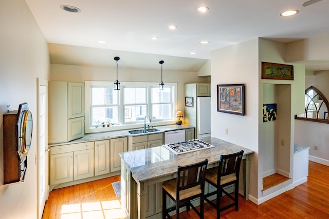 130 Lands End Rd, Derby, VT 05855 - kitchen featuring light stone countertops, a sink, white appliances, light wood-style flooring, and decorative light fixtures