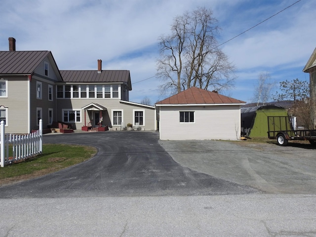 view of front of property featuring a standing seam roof and metal roof