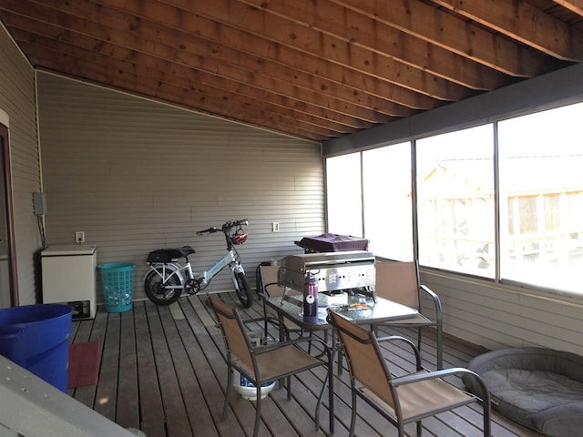 sunroom / solarium with outdoor dining space