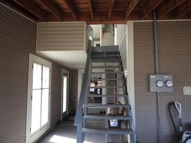 stairs with wood walls
