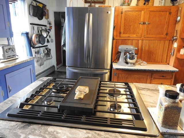 kitchen featuring brown cabinets and stainless steel appliances
