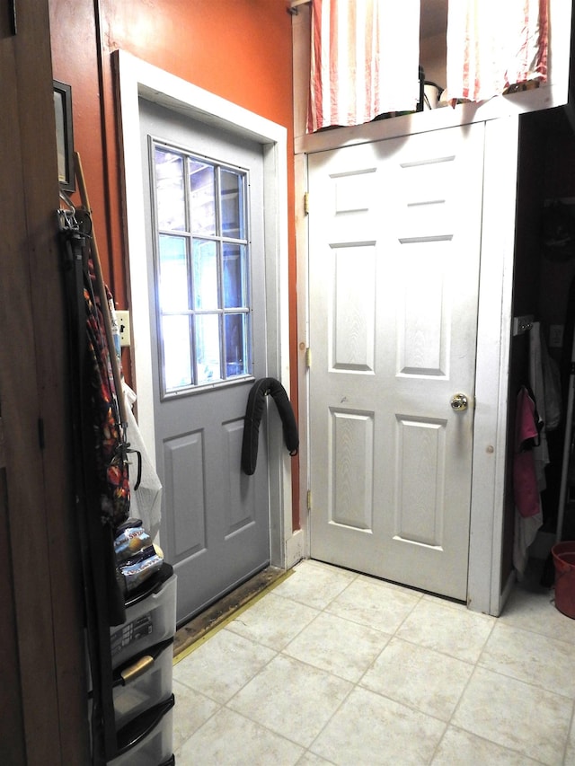entryway featuring light tile patterned floors