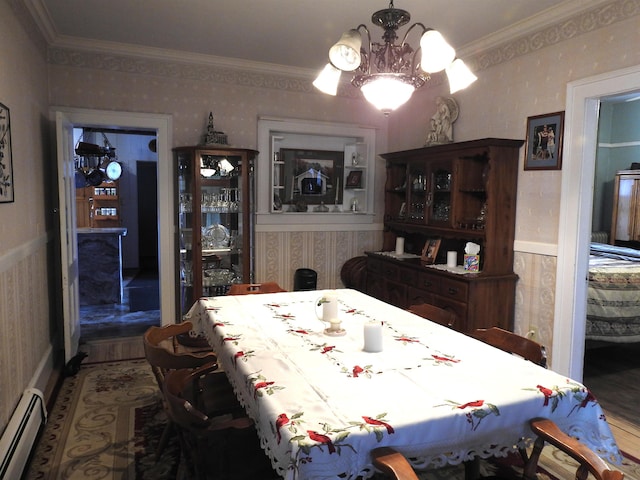 dining area featuring crown molding, baseboard heating, an inviting chandelier, and wallpapered walls