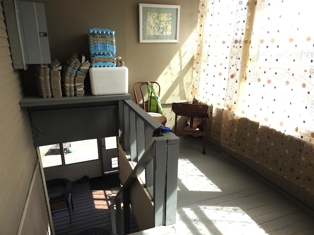 interior space with hardwood / wood-style floors and electric panel