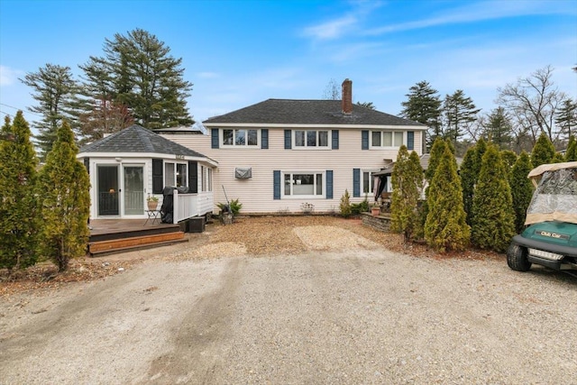 117A Chases Grove Rd, Derry, NH 03038 - view of front of property featuring an outbuilding, a wooden deck, and a chimney