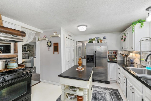 117A Chases Grove Rd, Derry, NH 03038 - kitchen with white cabinets, stainless steel refrigerator with ice dispenser, dark countertops, a sink, and black gas range