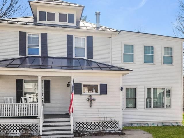 170 Myrtle St, Claremont, NH 03743 - view of front of property with a standing seam roof, covered porch, and metal roof