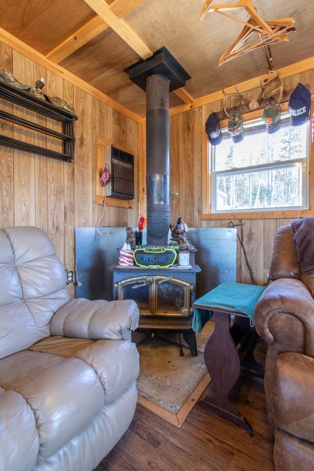 195 Curtis Rd, Morgan, VT 05853 - living room featuring wooden walls, wood finished floors, a wood stove, wood ceiling, and a wall mounted air conditioner