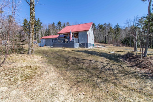 195 Curtis Rd, Morgan, VT 05853 - view of front of house with a wooded view and metal roof