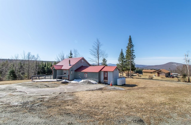 195 Curtis Rd, Morgan, VT 05853 - back of house with a metal roof and a mountain view