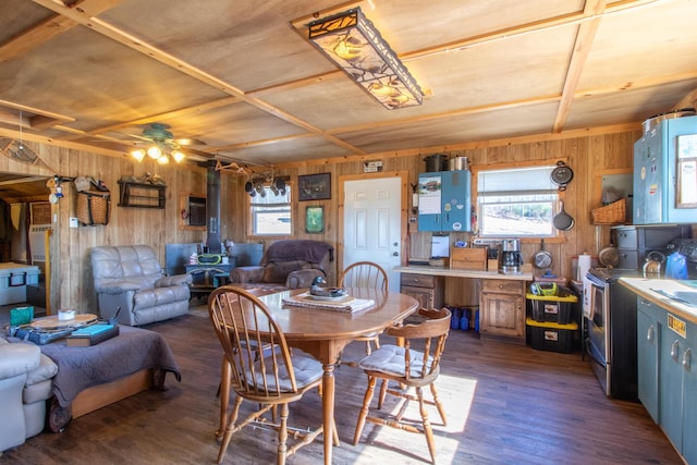 195 Curtis Rd, Morgan, VT 05853 - dining area with wood walls, healthy amount of natural light, wood finished floors, and a ceiling fan