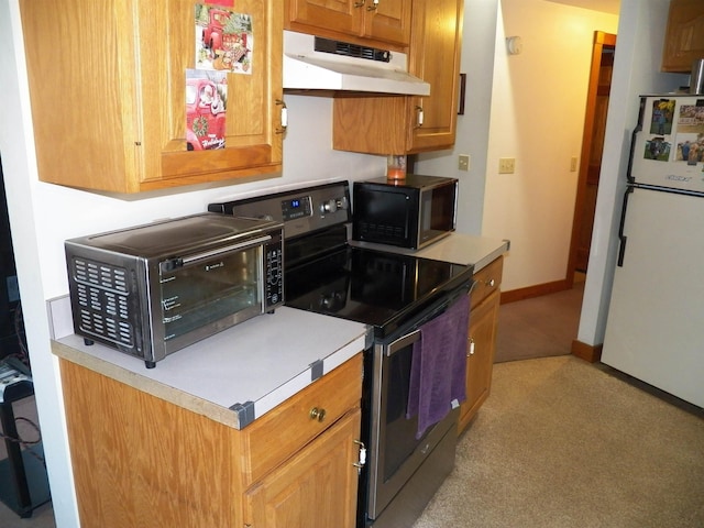 168 Bolton Rd, Winchester, NH 03470 - kitchen with a toaster, light countertops, freestanding refrigerator, under cabinet range hood, and stainless steel range with electric cooktop
