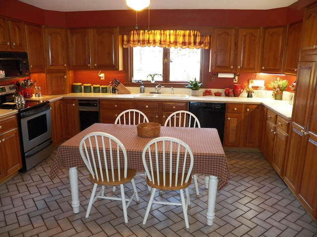 168 Bolton Rd, Winchester, NH 03470 - kitchen with light countertops, brick floor, a sink, and black appliances