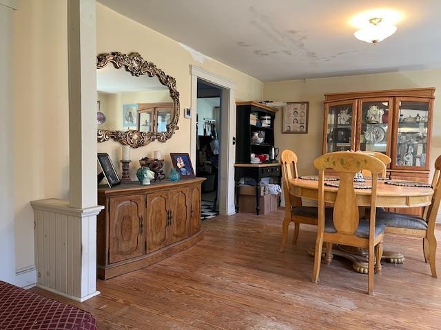 dining space featuring wood finished floors
