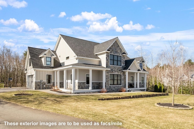 view of front of house featuring board and batten siding, a front yard, a porch, and stone siding