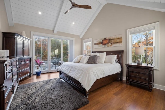 bedroom with baseboards, lofted ceiling with beams, a ceiling fan, dark wood-style floors, and access to exterior