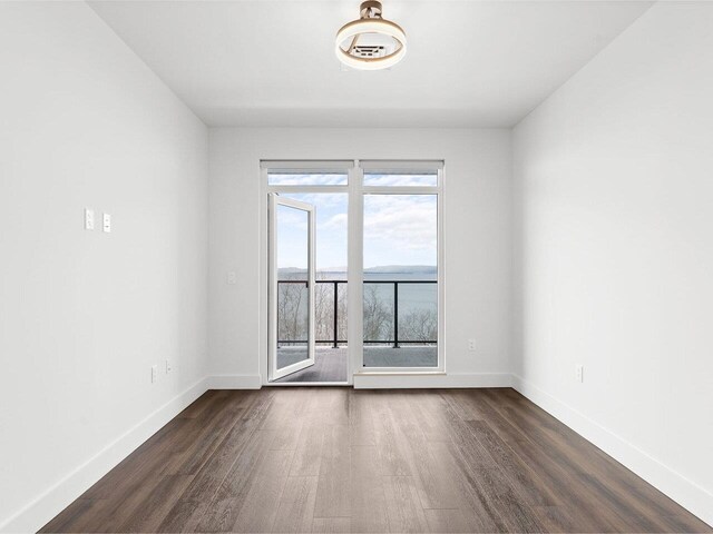 125 Cambrian Way Unit 605, Burlington, VT 05401 - empty room with dark wood-style floors and baseboards