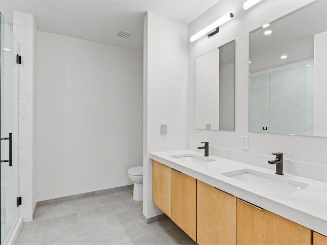 125 Cambrian Way Unit 605, Burlington, VT 05401 - bathroom featuring toilet, a shower stall, double vanity, recessed lighting, and baseboards
