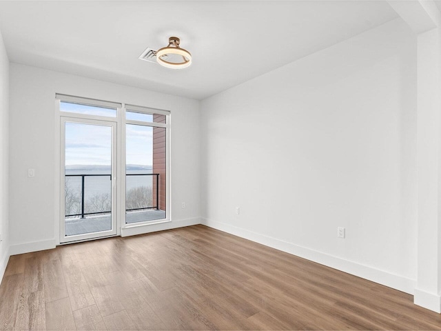 125 Cambrian Way Unit 605, Burlington, VT 05401 - empty room with wood finished floors and baseboards
