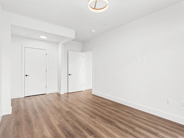 125 Cambrian Way Unit 605, Burlington, VT 05401 - unfurnished bedroom featuring wood finished floors and baseboards