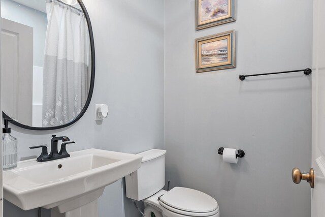 full bath with a sink and toilet