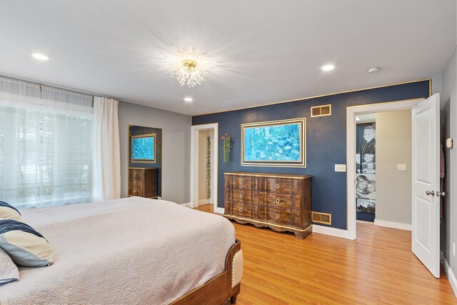 bedroom with recessed lighting, visible vents, baseboards, and light wood-style flooring