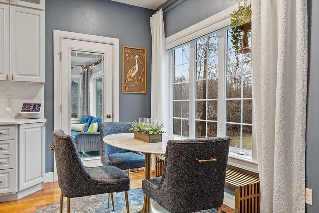 dining room with light wood finished floors