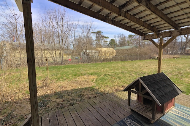 deck featuring fence and a lawn