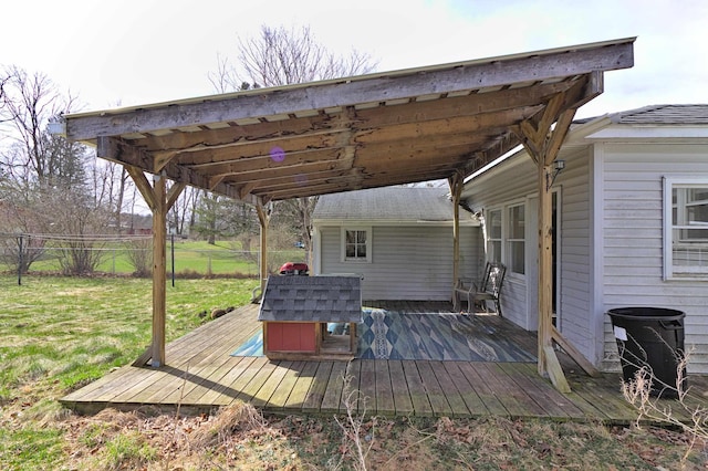 deck featuring fence and a lawn