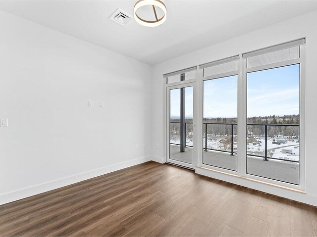 125 Cambrian Way Unit 611, Burlington, VT 05401 - unfurnished room featuring dark wood finished floors and baseboards