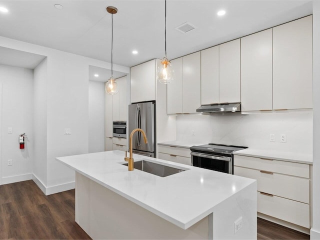 125 Cambrian Way Unit 611, Burlington, VT 05401 - kitchen with stainless steel appliances, dark wood-type flooring, white cabinets, recessed lighting, and light countertops