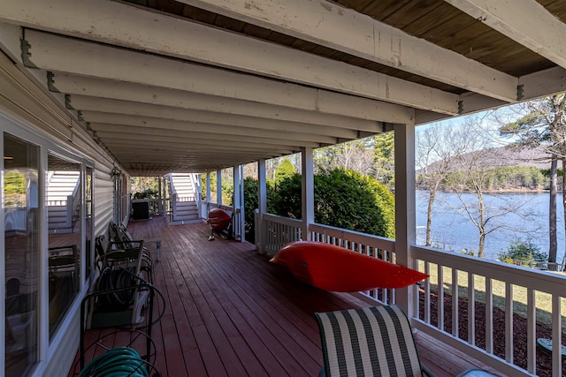 wooden terrace featuring a water view and area for grilling