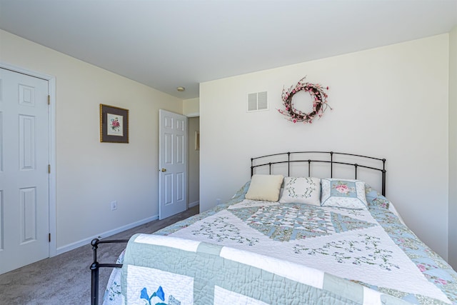 carpeted bedroom featuring visible vents and baseboards