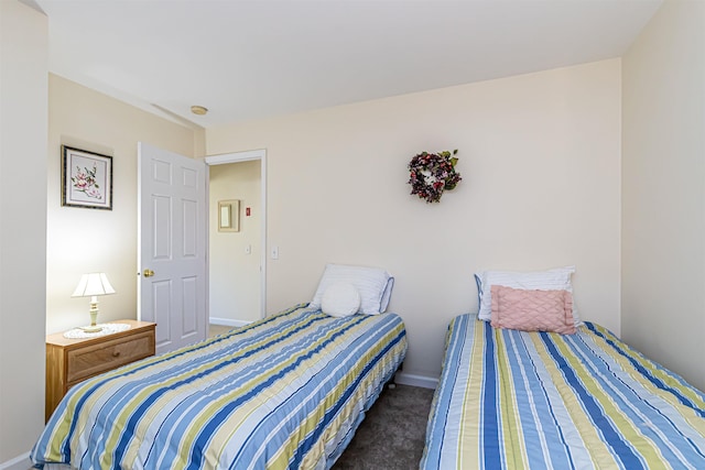 bedroom featuring carpet flooring and baseboards