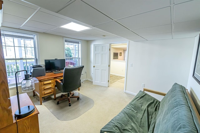 office with light carpet, baseboards, and a drop ceiling