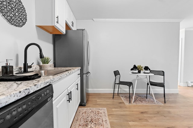 14 Strawberry Bank Rd Unit 2, Nashua, NH 03062 - kitchen with crown molding, appliances with stainless steel finishes, a sink, and white cabinetry