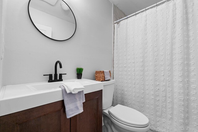 14 Strawberry Bank Rd Unit 2, Nashua, NH 03062 - bathroom featuring toilet, a shower with shower curtain, and vanity