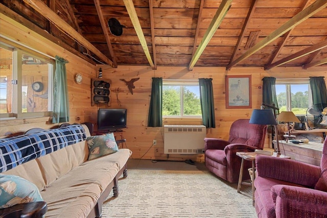 living room with wooden ceiling, wood walls, and lofted ceiling with beams