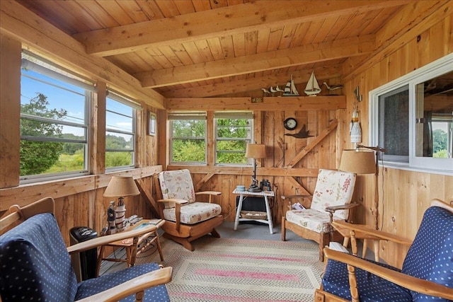 sunroom featuring wood ceiling, wooden walls, and lofted ceiling with beams