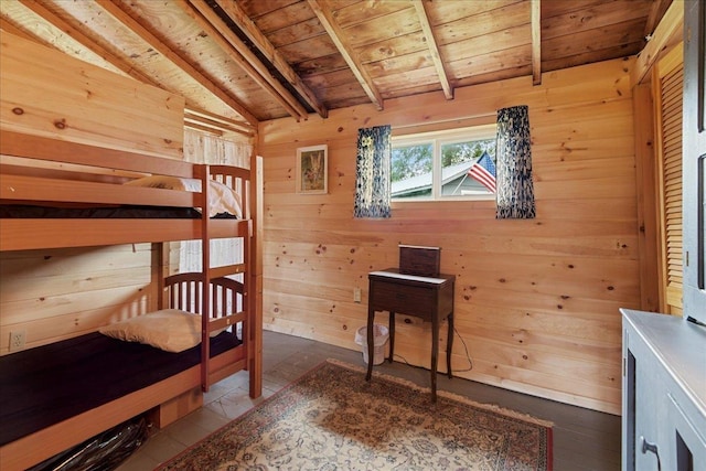 bedroom featuring wood walls, wooden ceiling, and vaulted ceiling with beams